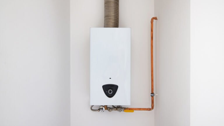 Compact tankless water heater installed on a wall, illustrating how to choose the right tankless water heater.