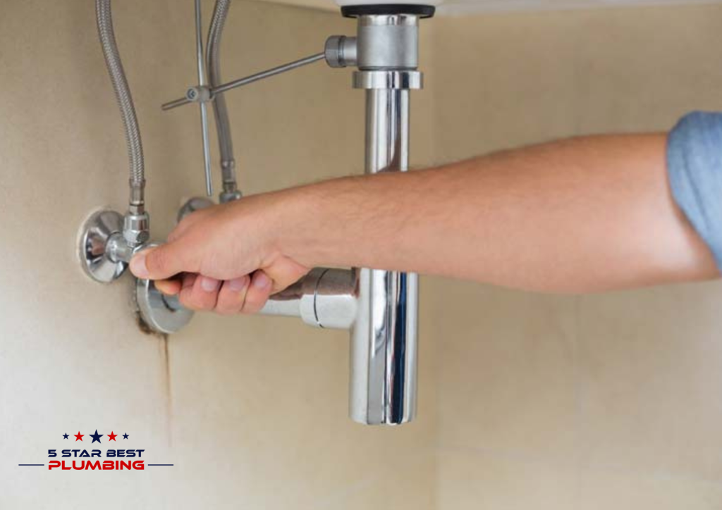 Turning off water supply shutoff valve under kitchen sink before starting leaky faucet repair